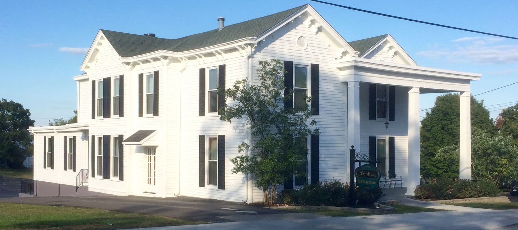 large home with fresh coat of white paint