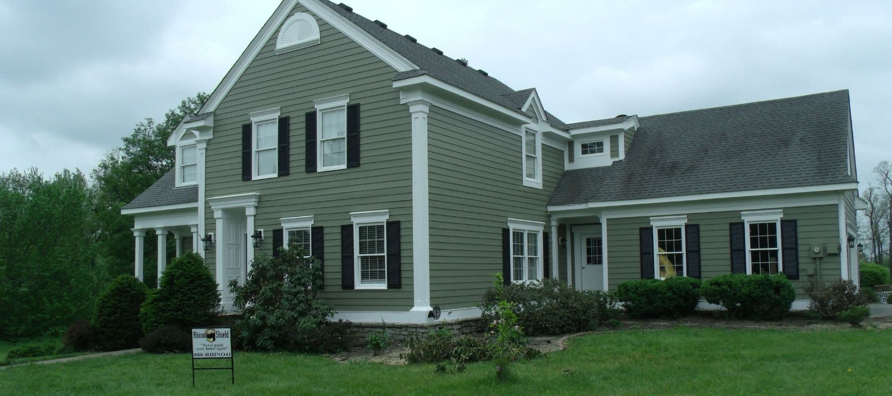 home with green painted siding