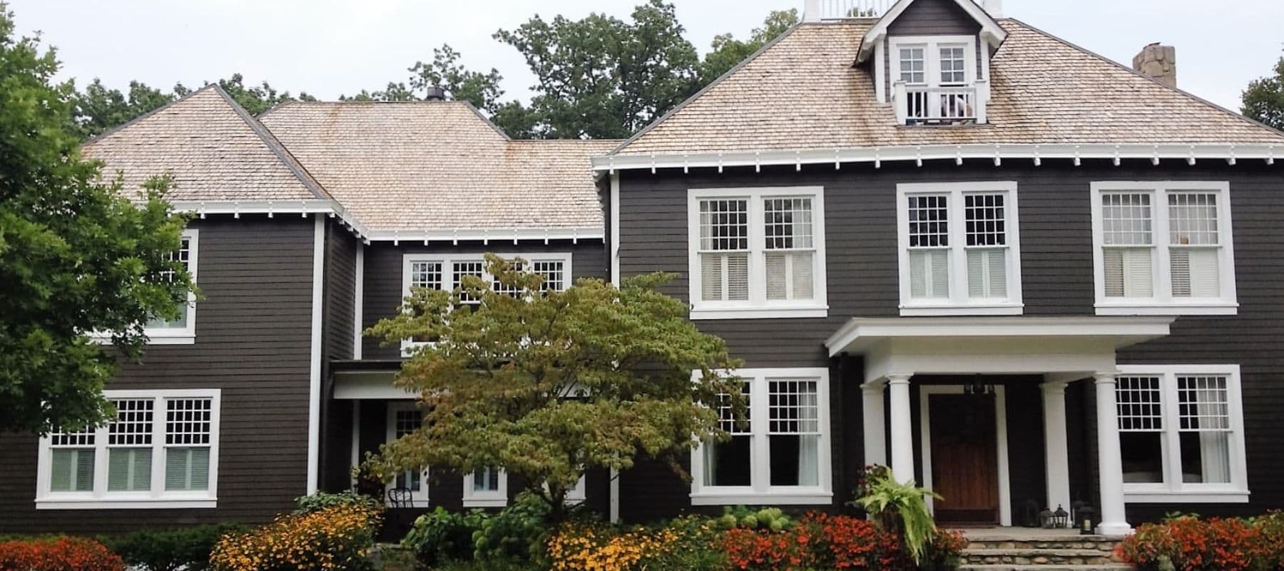 large home with dark brown siding