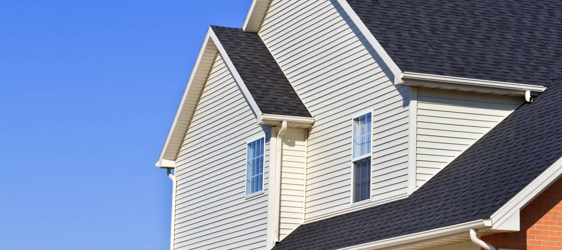 side of home with fresh painted vinyl siding