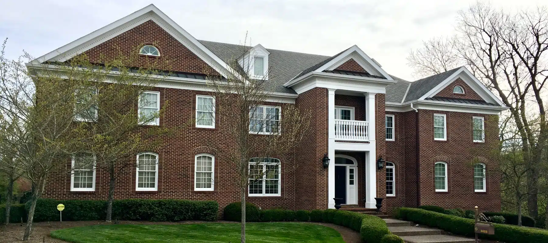 wide angle view of brick house